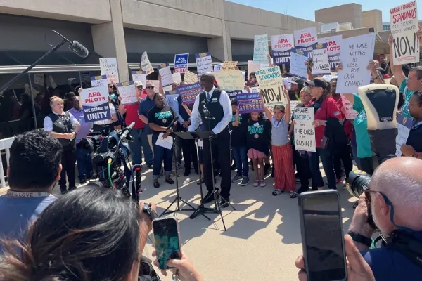 Airport service workers rally June 26, 2023