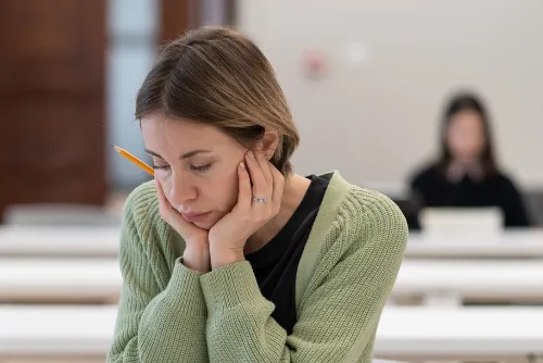 Worker looking down at her notebook