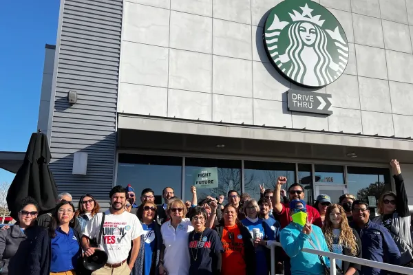 Union members standing in solidarity with Starbucks baristas