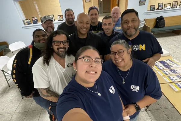 Volunteers pose for a photo before a block walk