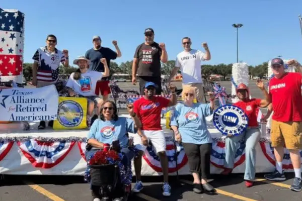 TARA members stand atop a parade float
