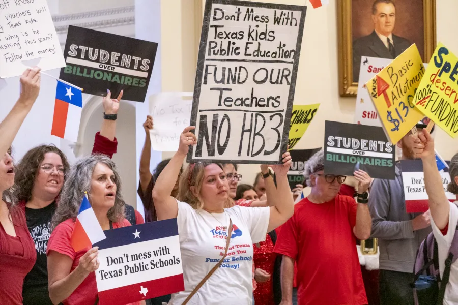 Protestors gather in the Capitol rotunda to advocate for public schools