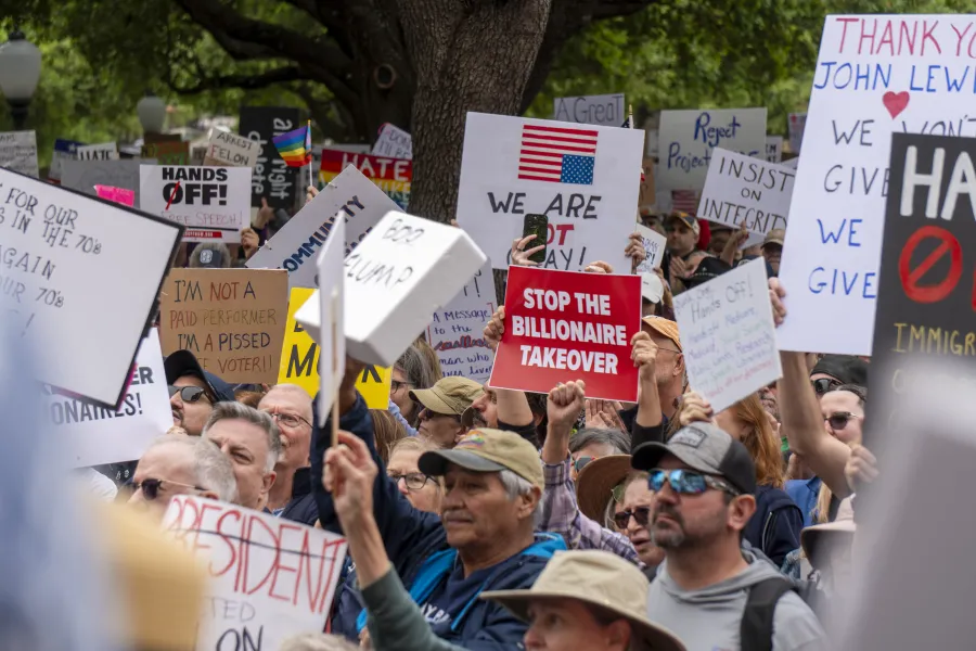 Stop the Billionaire Takeover Sign at a rally in Austin