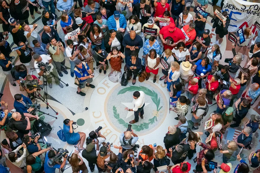 Texans fill the Capitol Rotunda to rally against Trump and Abbott's redistricting scheme