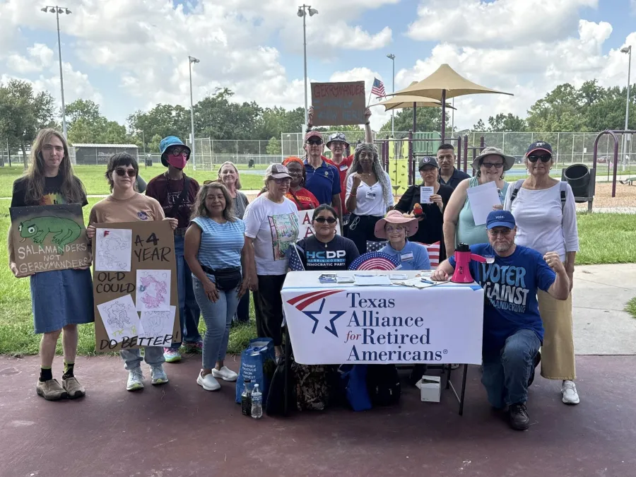 Texas Alliance for Retired Americans (TARA) members pose for a group photo at a tabling event