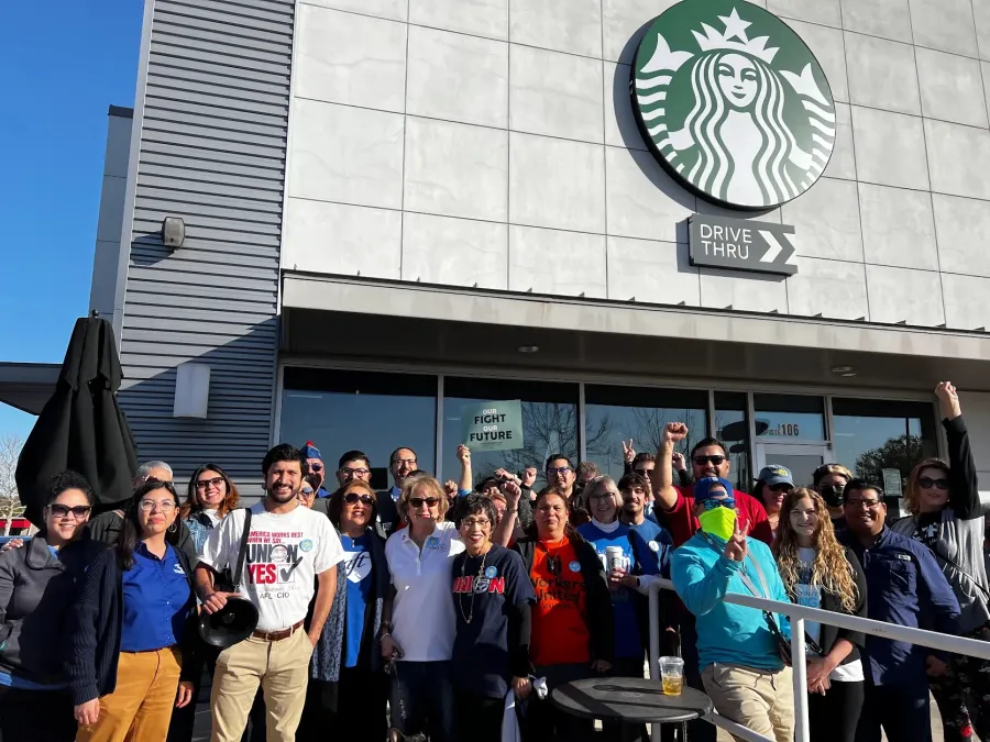 Union members standing in solidarity with Starbucks baristas