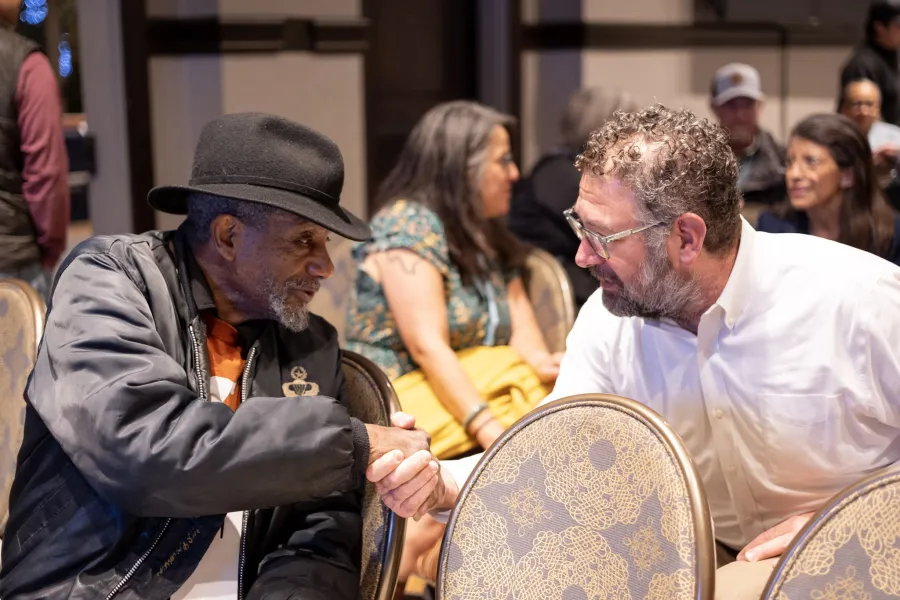 Union members shake hands at the 2026 Texas AFL-CIO COPE Convention