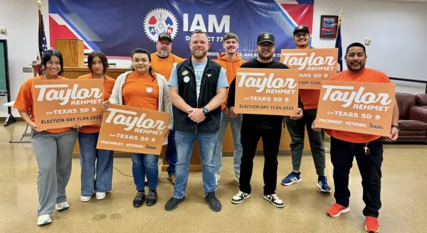 Taylor Rehmet with supporters at IAM union hall