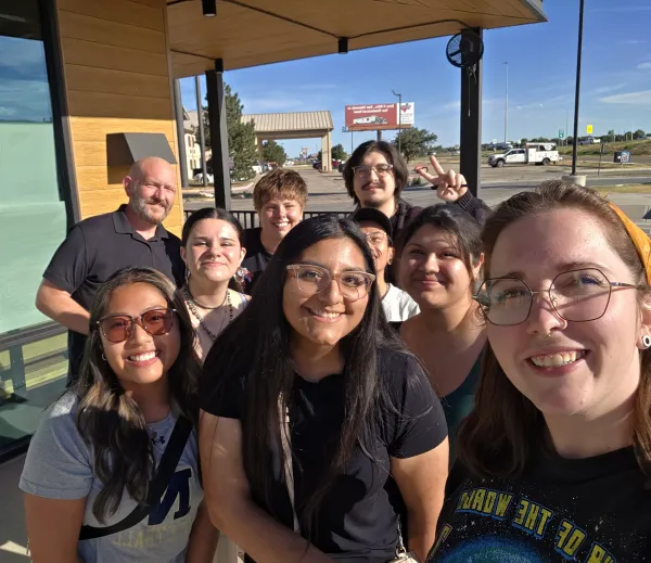 Starbucks baristas pose for a photo outside the Canyon & Hollywood store in Amarillo, TX